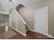 View of the home's foyer featuring wood floors, staircase and a neutral color palette at 303 Landis Oak Way, Landis, NC 28088
