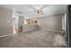 Open-concept living area with plush carpet, and a view of the adjoining kitchen at 303 Landis Oak Way, Landis, NC 28088
