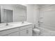 Bathroom featuring a double vanity and bathtub with shower, offering a bright and functional space at 3056 Ora Smith Rd, Lincolnton, NC 28092
