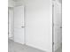 Neutral hallway leads to two doors, showcasing the home's practical design and layout at 3056 Ora Smith Rd, Lincolnton, NC 28092