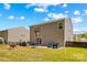 Large backyard boasts a patio, grill, and basketball hoop, offering a perfect blend of relaxation and recreation at 320 Silver Oak Cir, Rockwell, NC 28138