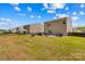 Spacious backyard featuring a patio, grill, basketball hoop, and ample green space, great for outdoor activities at 320 Silver Oak Cir, Rockwell, NC 28138