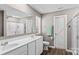 Bathroom featuring double sink vanity, large mirror, with private toilet and shower at 320 Silver Oak Cir, Rockwell, NC 28138