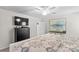 Comfortable primary bedroom featuring a ceiling fan, TV, and large windows at 320 Silver Oak Cir, Rockwell, NC 28138