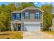 Charming two-story home featuring a front-facing garage, and lovely curb appeal at 320 Silver Oak Cir, Rockwell, NC 28138