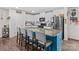 Kitchen island with granite countertop, breakfast bar seating, and stainless steel appliances at 320 Silver Oak Cir, Rockwell, NC 28138