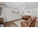 Spacious living room with lots of natural light, comfortable seating, and hardwood floors at 320 Silver Oak Cir, Rockwell, NC 28138