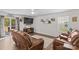 Cozy living room with comfortable leather seating and a view of the backyard at 320 Silver Oak Cir, Rockwell, NC 28138