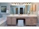 Bathroom boasts dual vanities, a large mirror, and a soaking tub for a spa-like experience at 3404 Pasture View Ct, Charlotte, NC 28269