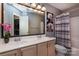 Bathroom with a double sink vanity, a large mirror, and a shower-tub combo at 3404 Pasture View Ct, Charlotte, NC 28269