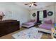 Inviting bedroom with matching twin beds, a floral rug, and ample storage space at 3404 Pasture View Ct, Charlotte, NC 28269