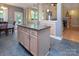 Kitchen island featuring granite countertops and ample storage, perfect for meal preparation and casual dining at 3404 Pasture View Ct, Charlotte, NC 28269