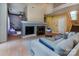 Spacious living room with a cozy fireplace, comfortable seating, and easy access to other living areas at 3404 Pasture View Ct, Charlotte, NC 28269