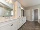 Bathroom boasts double vanity with white cabinetry and modern fixtures at 358 Hampton Trail Dr, Fort Mill, SC 29708
