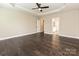 Spacious bedroom featuring hardwood floors, tray ceiling, and ceiling fan at 358 Hampton Trail Dr, Fort Mill, SC 29708