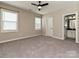 Bedroom featuring 2 windows, neutral carpet, and a ceiling fan at 358 Hampton Trail Dr, Fort Mill, SC 29708