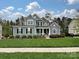 Beautiful two-story home with lovely lawn, landscaping and black shutters at 358 Hampton Trail Dr, Fort Mill, SC 29708