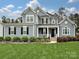 Charming two-story home features a well-manicured lawn and inviting front porch at 358 Hampton Trail Dr, Fort Mill, SC 29708