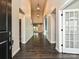 Grand foyer featuring soaring ceilings, dark hardwood floors, and elegant lighting at 358 Hampton Trail Dr, Fort Mill, SC 29708