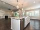 Open-concept kitchen with center island, stainless steel dishwasher, and access to the living room at 358 Hampton Trail Dr, Fort Mill, SC 29708