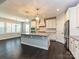 Spacious kitchen with large island, stainless steel appliances and modern pendant lighting at 358 Hampton Trail Dr, Fort Mill, SC 29708