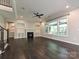 Spacious living room featuring a fireplace, built-in shelves, and an abundance of natural light at 358 Hampton Trail Dr, Fort Mill, SC 29708