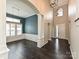 Bright living room with tall ceilings, wainscoting, and dark wood floors at 358 Hampton Trail Dr, Fort Mill, SC 29708