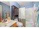 Bathroom with a combined shower and tub, toilet, and vanity with storage at 3606 White Swan Ct, Indian Trail, NC 28079