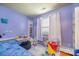Bright bedroom with colorful decor, playful elements, and a cozy atmosphere at 3606 White Swan Ct, Indian Trail, NC 28079