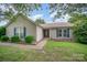 Charming single-story home featuring blue shutters, a well-manicured lawn, and a welcoming front porch at 3606 White Swan Ct, Indian Trail, NC 28079