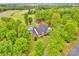 Stunning aerial view of the property showcasing the home, pool, outbuilding, and lush landscape at 3871 Cool Branch Dr, Maiden, NC 28650