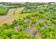 Aerial view showcasing a neighborhood with lush greenery, well-maintained lawns, and mature trees at 3871 Cool Branch Dr, Maiden, NC 28650