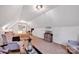 Attic bedroom featuring neutral walls, carpet floors, a comfortable chair, and a mini-split system at 3871 Cool Branch Dr, Maiden, NC 28650