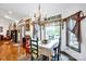 Charming dining room with traditional decor, a view to the fireplace, and plenty of natural light at 3871 Cool Branch Dr, Maiden, NC 28650