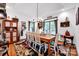 Traditional dining room featuring a rustic table, decorative rug, and ample natural light from nearby windows at 3871 Cool Branch Dr, Maiden, NC 28650