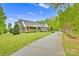 Beautiful home featuring a long driveway and a well-manicured lawn at 3871 Cool Branch Dr, Maiden, NC 28650