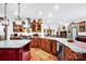 Open kitchen with custom cabinetry, granite counters, stainless steel appliances and views to dining area at 3871 Cool Branch Dr, Maiden, NC 28650