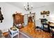 Office space with hardwood floors, a decorative dresser, and an open doorway at 3871 Cool Branch Dr, Maiden, NC 28650