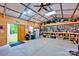 Spacious outbuilding interior with a workbench, tools, and ample storage at 3871 Cool Branch Dr, Maiden, NC 28650