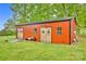 Exterior view of the red barn-style outbuilding with double doors and decorative wreaths at 3871 Cool Branch Dr, Maiden, NC 28650