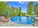 Inviting above-ground pool with surrounding deck and comfortable lounge chair at 3871 Cool Branch Dr, Maiden, NC 28650