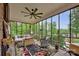 Relaxing sunroom featuring lots of natural light, brick floors, wicker chairs, and a ceiling fan at 3871 Cool Branch Dr, Maiden, NC 28650