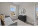 Bright, carpeted bedroom with gray dresser and decor at 4100 Alexander View Dr # 1, Charlotte, NC 28226