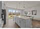 Modern kitchen with white cabinets, large island and stainless steel refrigerator at 4100 Alexander View Dr # 1, Charlotte, NC 28226