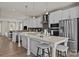 Modern kitchen featuring white cabinets, an island with seating, and stainless steel appliances at 4100 Alexander View Dr # 1, Charlotte, NC 28226