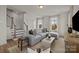 Bright living room featuring a large sectional sofa, neutral decor, and hardwood floors at 4100 Alexander View Dr # 1, Charlotte, NC 28226
