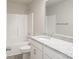 Bright bathroom featuring granite countertops and white cabinets at 4149 River Run Cir, Hickory, NC 28602