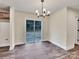 Bright dining room with wood floors and sliding door to the backyard at 4149 River Run Cir, Hickory, NC 28602