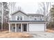 Charming two-story home with gray siding, white trim and a two car garage at 4149 River Run Cir, Hickory, NC 28602