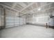 Spacious two car garage with concrete floor and an automatic door opener at 4149 River Run Cir, Hickory, NC 28602
